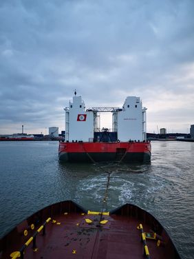 WULF 9 astern view on BOA BARGE 36 being towed